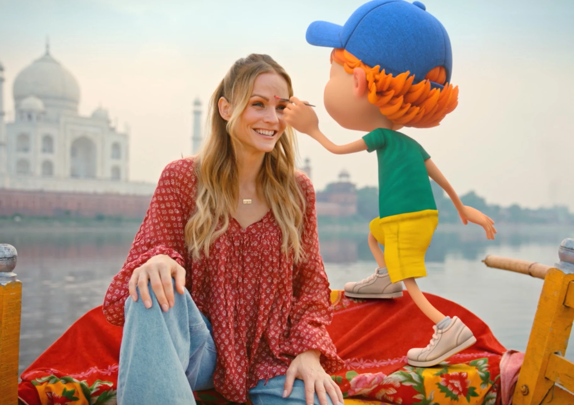 Miriam and animated Oskar in a boat in front of the Taj Mahal